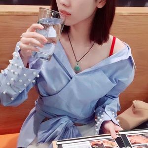 Wrap top and long sleeves with pearl buttons